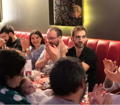 People enjoying live folk music at Edinburgh dinner